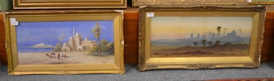 Lot 1200 - Circle of Frederick Goodall (1822-1904), Desert scene with camels in the foreground, a town...