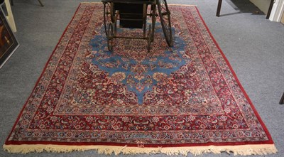 Lot 1212 - A Mashad carpet, the sky blue field of floral sprays around a candy pink medallion framed by...