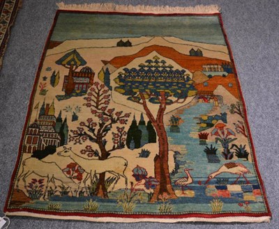 Lot 1215 - An unusual pictorial Kashan rug, Central Iran, depicting a rural scene, 128 by 97cm