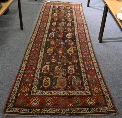 Lot 1219 - A Talish runner, South East Caucasus, the charcoal field with rows of polychrome boteh enclosed...