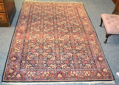 Lot 1227 - Feraghan rug, West Persia, the indigo Herati field enclosed by madder borers of palmettes and...