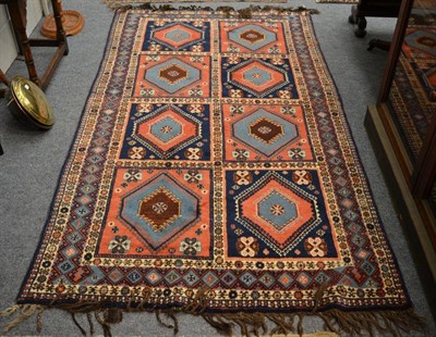 Lot 1233 - A Yalameh rug, central Persia, the compartmentalised field of hooked medallions enclosed by...