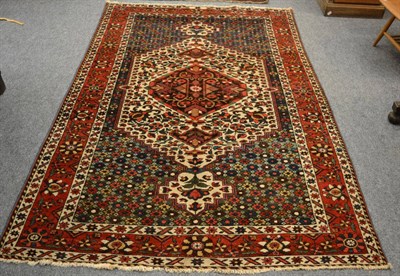 Lot 1241 - A Bakhtiyari rug, West Persia, the ivory stepped lozenge field centred by a diamond anchor...