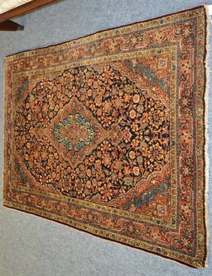 Lot 1250 - A Jozan rug, West Iran, The indigo field of floral vines around a soft madder pole medallion framed