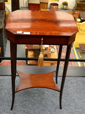 Lot 1297 - A late 19th century/early 20th century mahogany sewing table on splayed legs