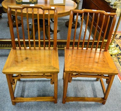 Lot 1298 - A pair of Chinese elm Shanghai chairs