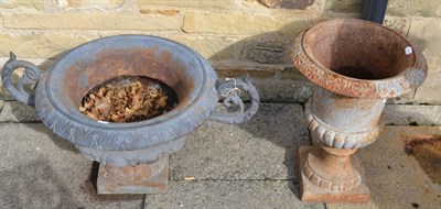 Lot 1299 - A cast iron garden urn 78cm diameter and a Campana shaped urn 53cm diameter