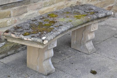 Lot 1302 - #A weathered composition curved garden bench, 123cm wide