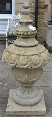 Lot 1309 - A matching pair of garden urns with raised finial, egg and dart frieze on pedestal base, 147cm high