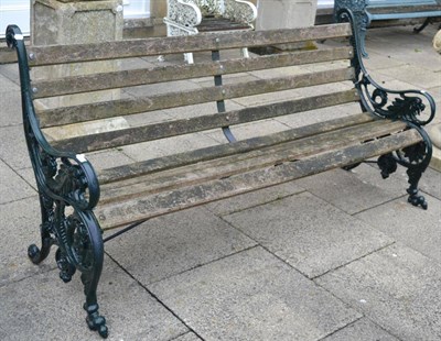 Lot 1310 - #A Victorian green painted cast iron garden bench with wooden slats (a.f.), 195cm wide