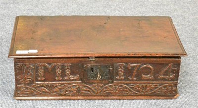 Lot 1337 - An 18th century joined oak table box, carved with initials M L and dated 1724