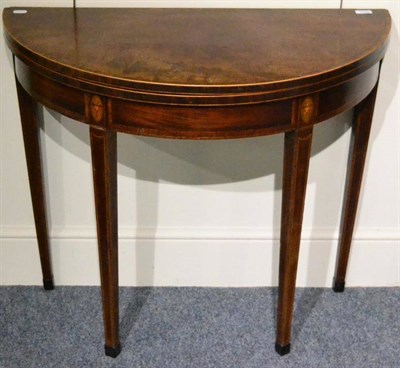 Lot 1345 - A George III inlaid demi-lune tea table