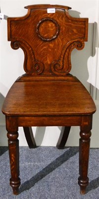 Lot 1348 - A pair of Victorian oak hall chairs