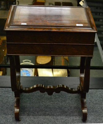 Lot 1370 - A 19th century rosewood and boxwood strung sewing table, with hinged lid above one real and one...