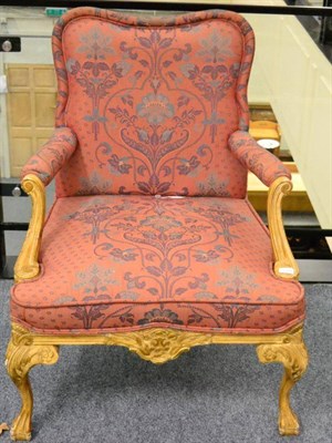 Lot 1375 - A pair of gilt armchairs, of recent date, raised on acanthus carved legs, in the French 18th...