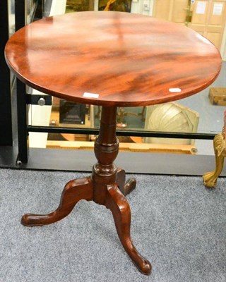 Lot 1377 - A late George III mahogany flip top tripod table