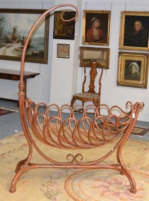 Lot 1388 - A Thonet bentwood cradle, circa 1890, 132cm wide