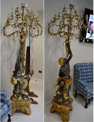 Lot 1392 - A pair of 20th Century Blackamoor figures each with fourteen gilt metal branches suspending cut...