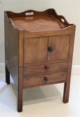 Lot 1395 - A George III mahogany tray top bedside cupboard, together with a similar example with two...