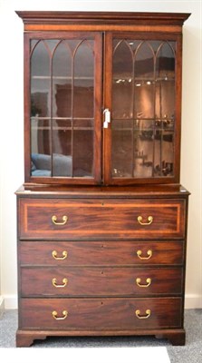 Lot 1404 - A George III mahogany and satinwood banded bureau bookcase, circa 1800, the ogee moulded...