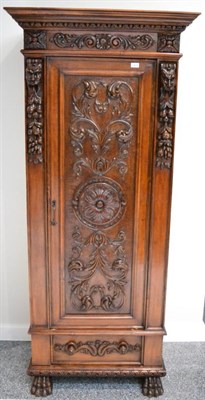 Lot 1410 - A 19th century walnut baroque style carved cupboard on claw feet