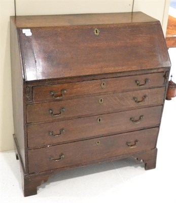 Lot 1414 - An 18th century oak bureau