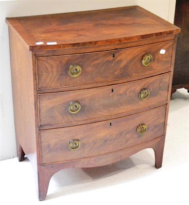 Lot 1418 - A mahogany bow fronted three drawer chest on bracket feet