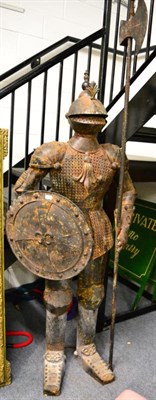 Lot 1434 - A suit of armour in weathered condition