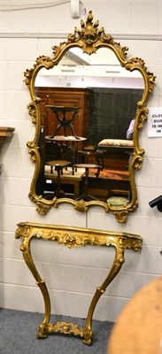 Lot 1437 - A reproduction gilt console table with yellow Sienna marble top and cartouche shaped mirror