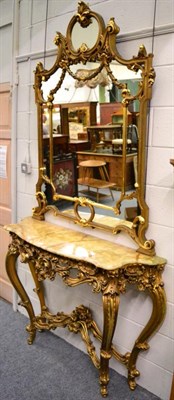 Lot 1439 - A reproduction console table with onyx top and marginal mirror