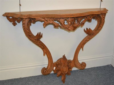 Lot 1443 - A George III pine console table with acanthus carved supports