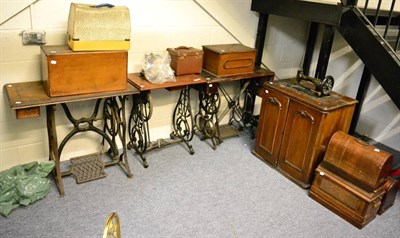 Lot 1444 - Three treadle sewing machines, a table and five assorted hand sewing machines