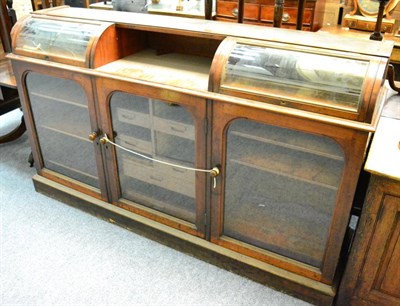 Lot 1448 - A Victorian mahogany glazed shop counter with two hinged lids above three glazed doors, lacking top