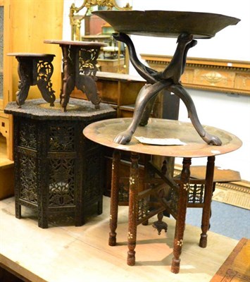 Lot 1457 - An Eastern brass top folding tray, a Moorish style carved table, two small hardwood plant...