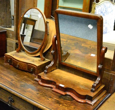 Lot 1474 - ^A George III mahogany oval swing dressing table mirror, circa 1800 together with another (2)