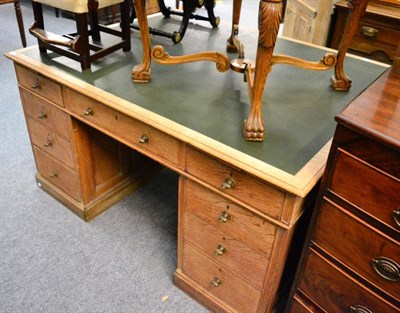 Lot 1476 - An oak partners' desk with inset leather writing surface, fitted with three frieze drawers on...