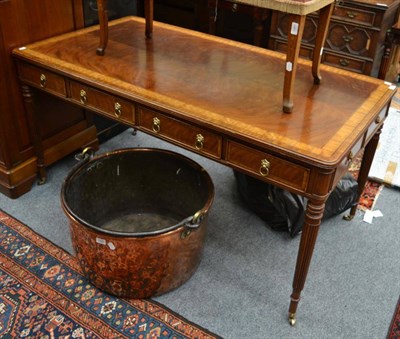 Lot 1479 - A reproduction mahogany and cross banded Regency style library table