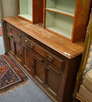 Lot 1499 - An Edwardian oak sideboard with two drawers