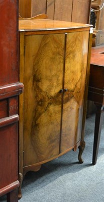 Lot 1507 - A 1930's walnut bow fronted linen chest