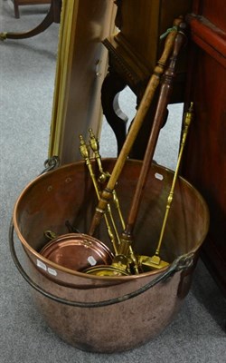 Lot 1509 - A large 19th century copper log bin with iron swing handle, 63cm diameter; two warming pans;...