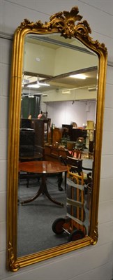 Lot 1512 - A large reproduction gilt mirror