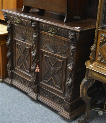 Lot 1514 - A 19th century Renaissance revival oak side cabinet with two frieze drawers above twin cupboard...