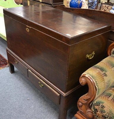 Lot 1523 - A George II mahogany chest on stand, mid 18th century, with hinged lid and brass solid...