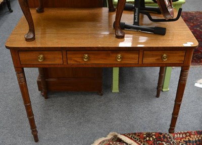 Lot 1525 - A Regency mahogany and ebonised three drawer side table