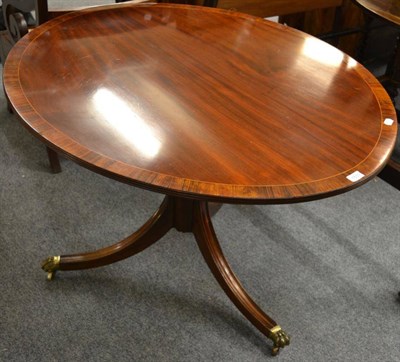 Lot 1531 - A reproduction mahogany pedestal dining table, labelled 'Coopers of Ilkley'