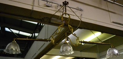 Lot 1541 - A Victorian brass ornate light fitting, fitted three opalescent shades