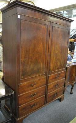 Lot 1547 - A George III mahogany double door wardrobe, fitted with six dummy drawers