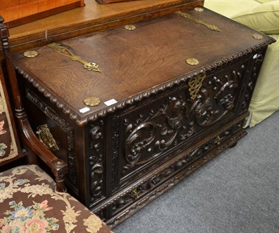 Lot 1549 - A carved oak chest