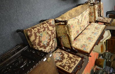 Lot 1550 - A rosewood three piece suite, labelled J Taylor & Sons