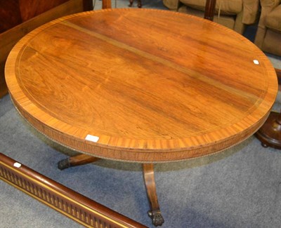 Lot 1557 - A 19th century rosewood and satinwood banded circular dining table